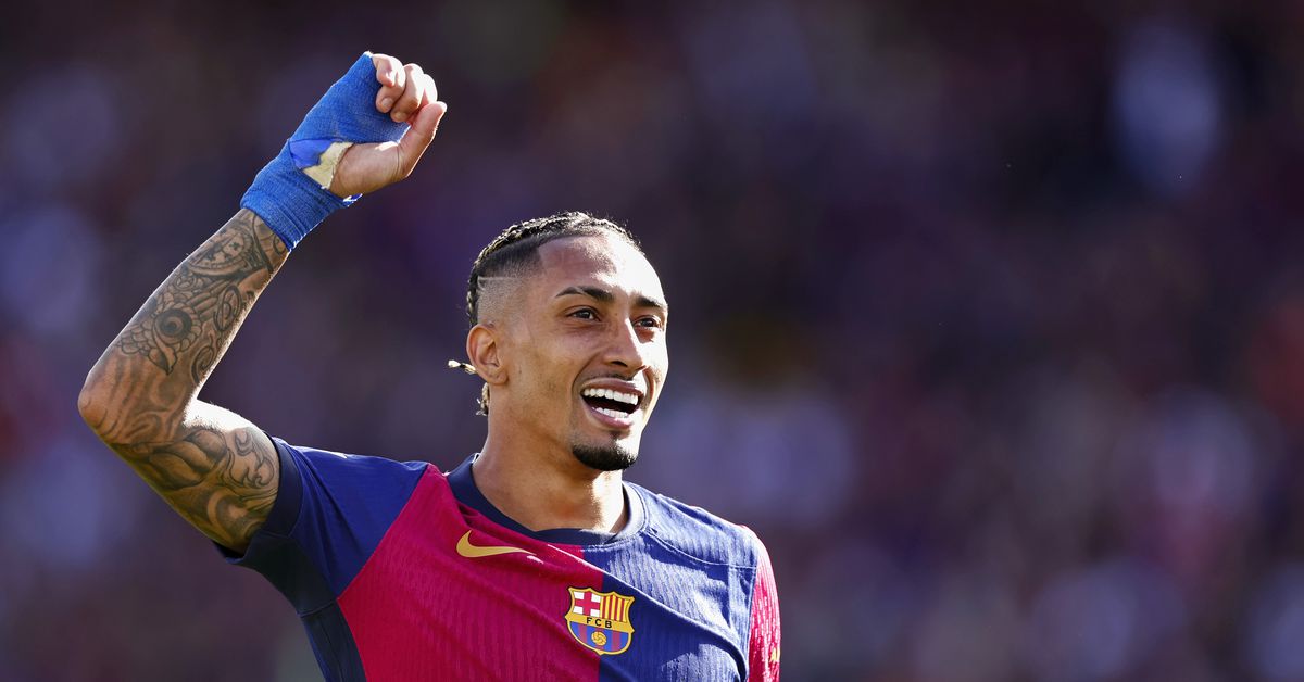 WATCH: Raphinha walks across Barcelona pitch on his knees after winning La Liga